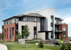 A large apartment building with an expansive driveway, part of the Richardson Ridge community in Ottawa.