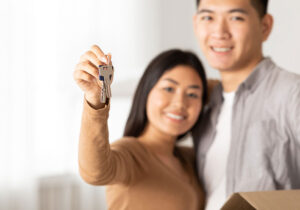 Image of a couple holding keys