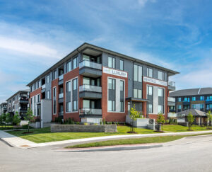 Wateridge Village apartment complex located at the street corner, showcasing modern architecture and green spaces.