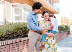 Family bonding outside their rental condo in Rockcliffe's Wateridge Village, enjoying the neighborhood's charm.